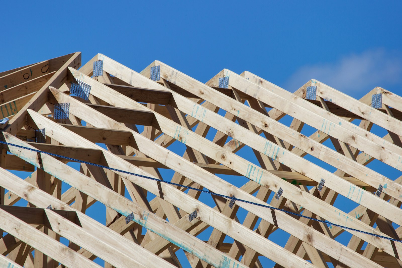 Prefabricated wooden roof trusses joined with metal plates